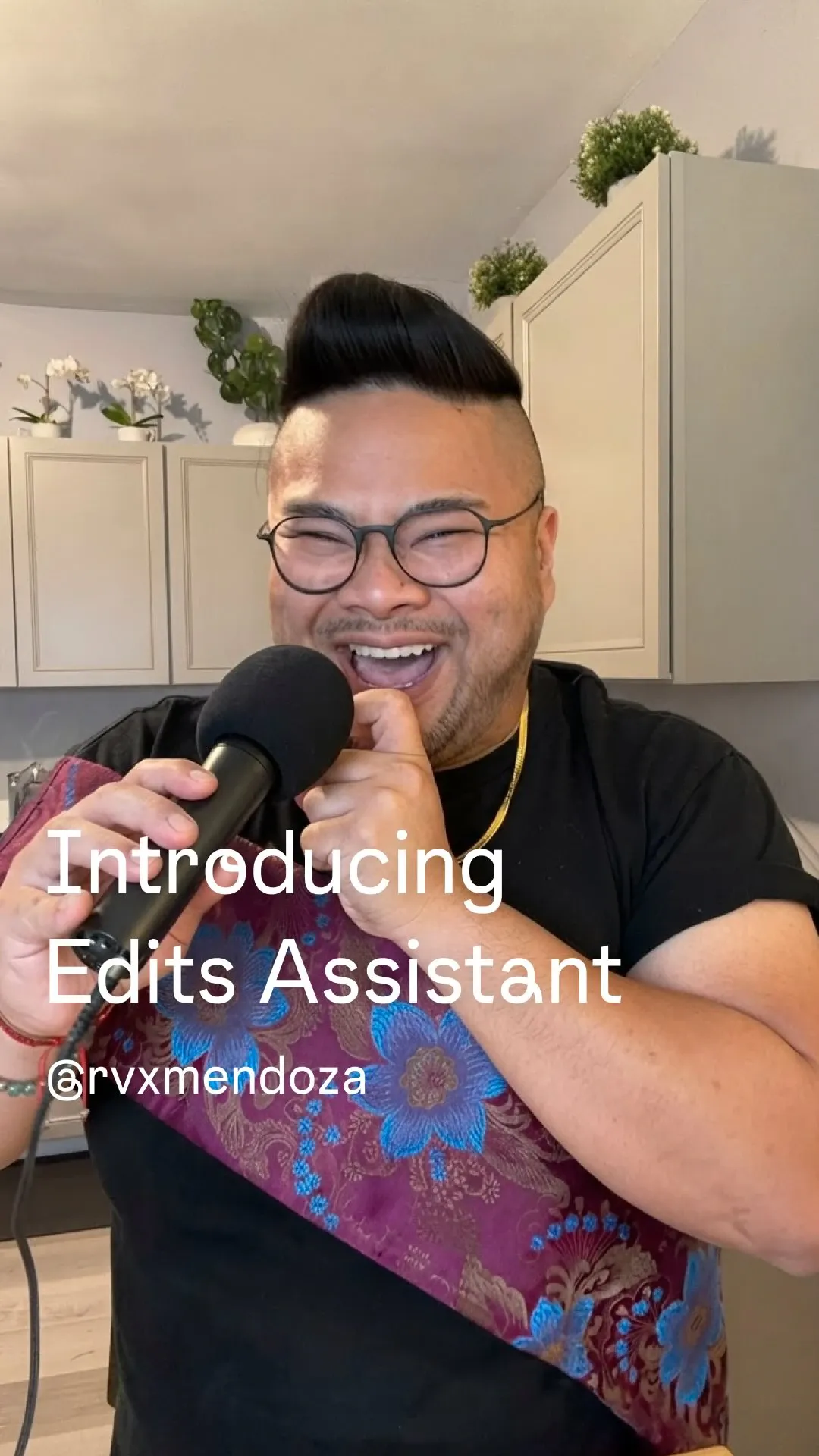 I laugh into a microphone beneath the words Introducing Edits Assistant.
