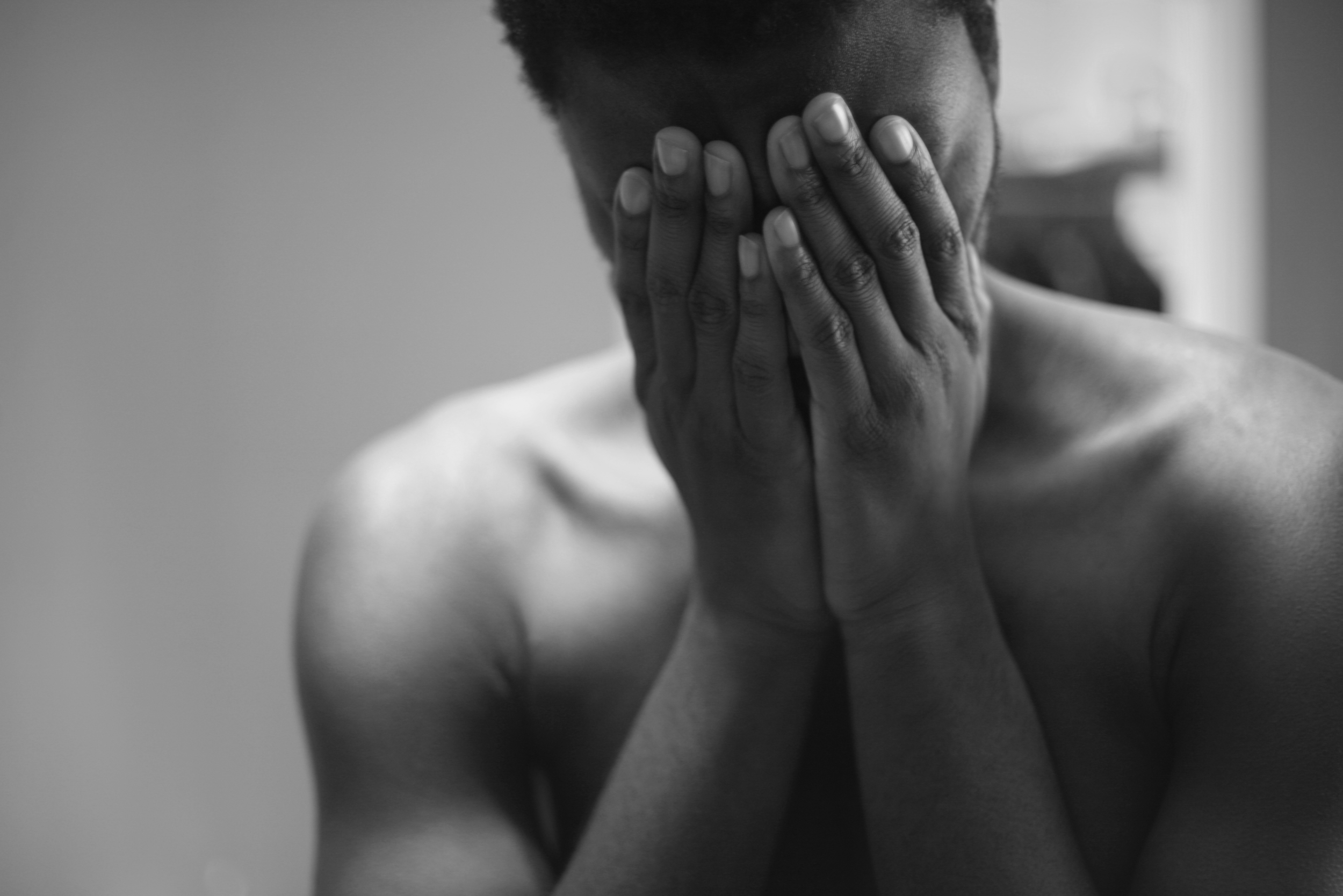 Someone covering their face with their hands.
