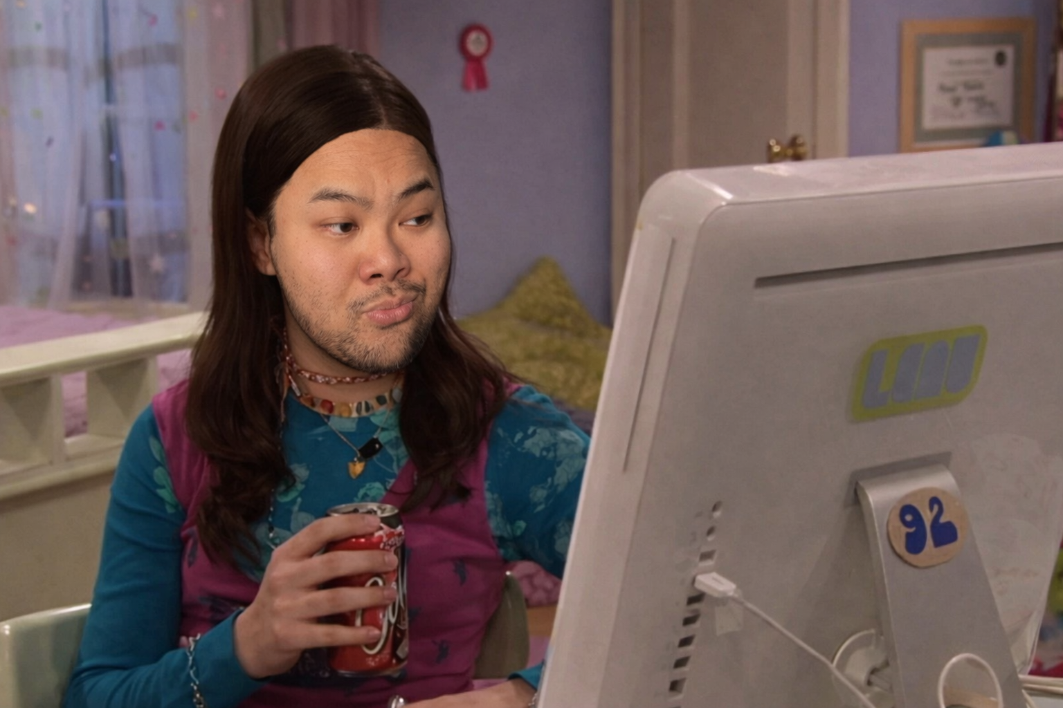 RV Mendoza seated at a computer in a playful illustrated scene